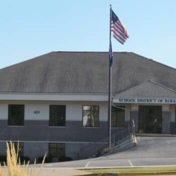 School district building with American flag outside