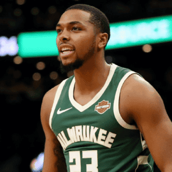 Basketball player wearing Milwaukee Bucks jersey on court