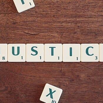 Name "Justice" on table
