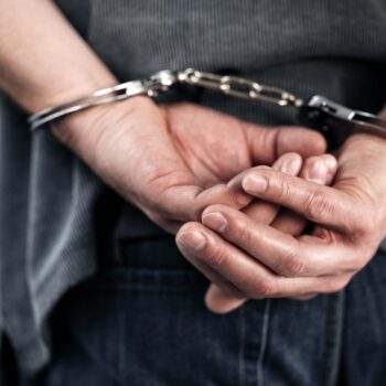 Man arrested in handcuffs