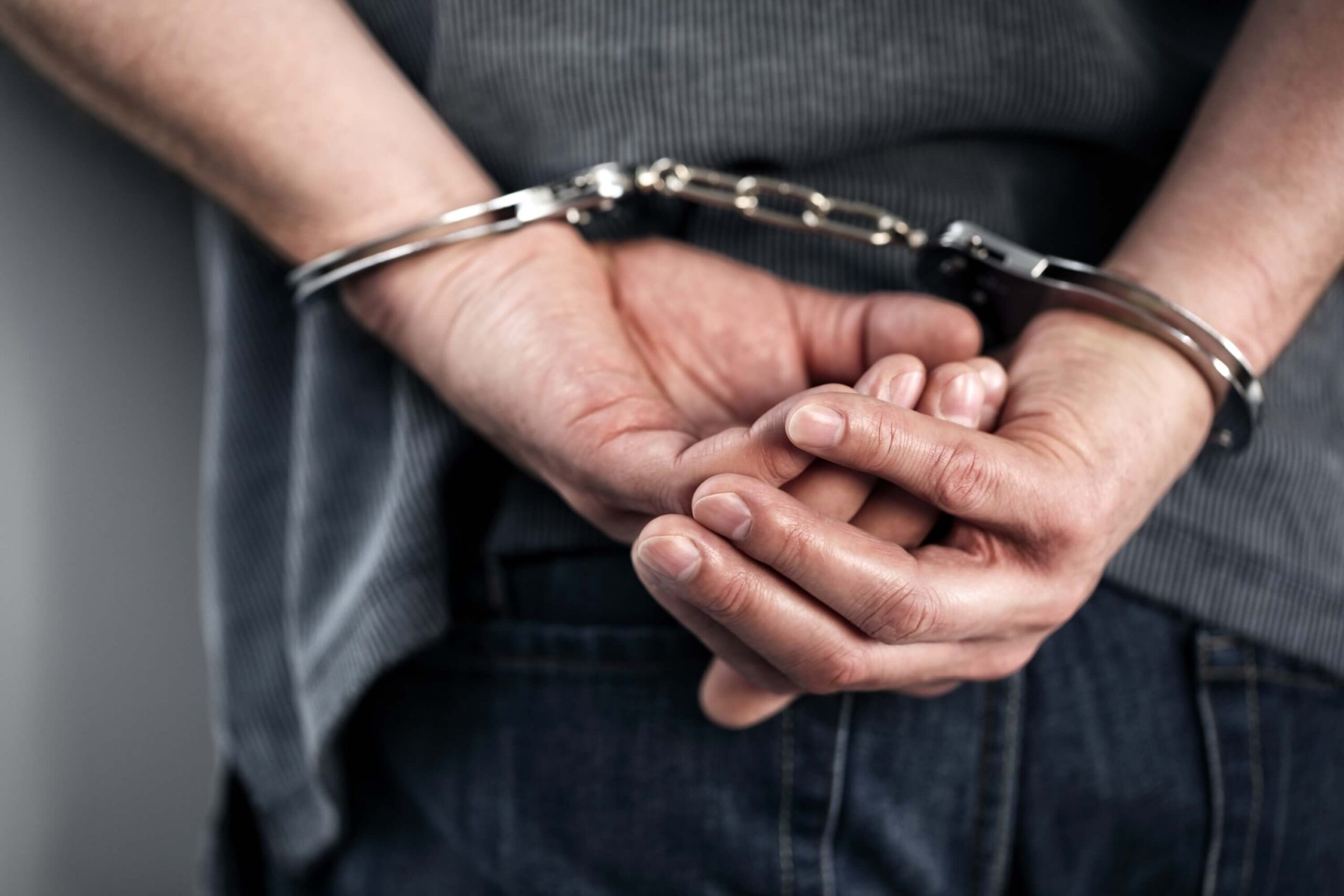 Man arrested in handcuffs